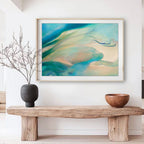 Framed abstract floral fine art print, Liminalis by Eva Cassini in jade and aqua colours, on wall over wooden bench