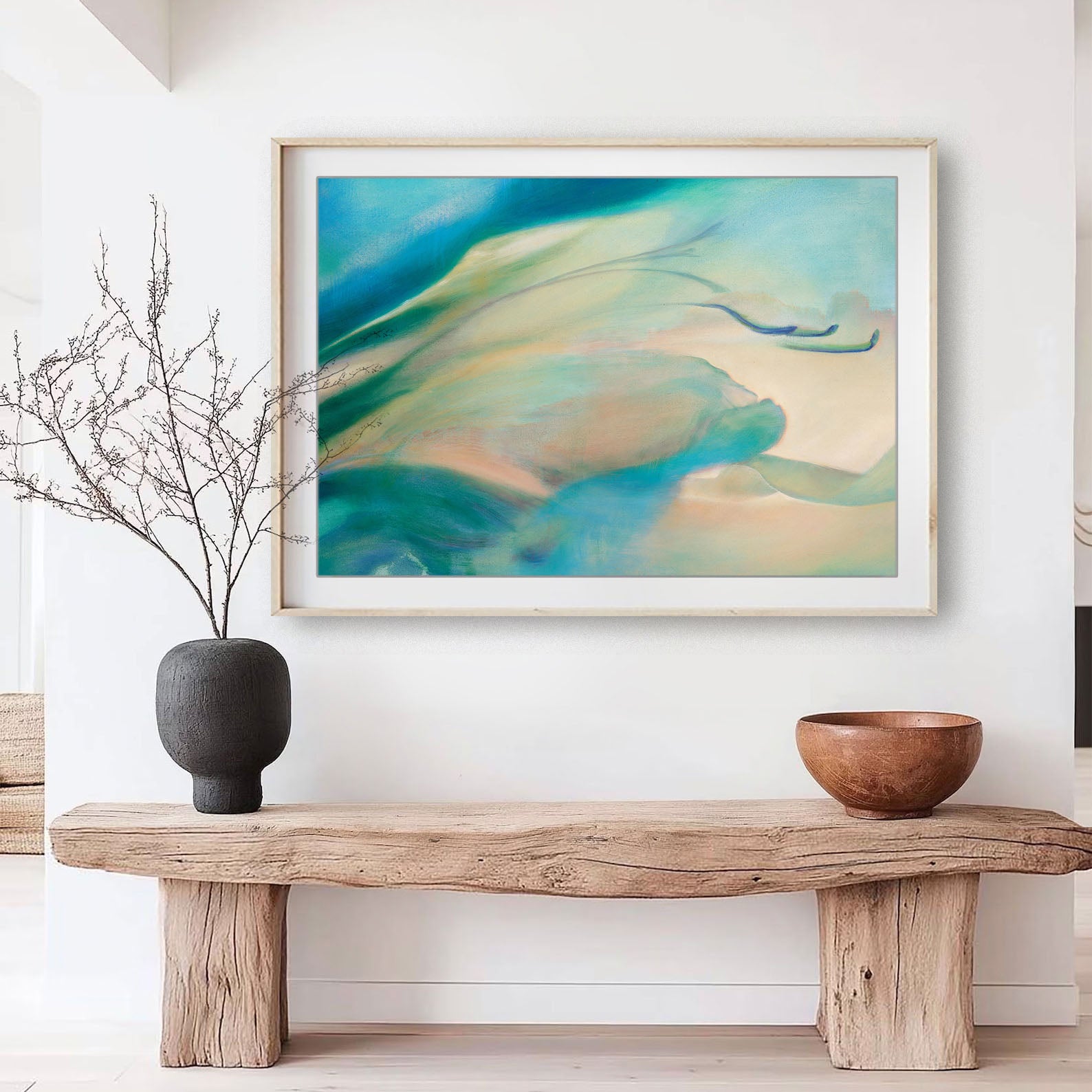 Framed abstract floral fine art print, Liminalis by Eva Cassini in jade and aqua colours, on wall over wooden bench