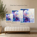 Three floral art prints of different sizes on a wall with a bench and plant.